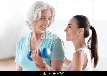 Pleasant delighted woman having a great time Stock Photo