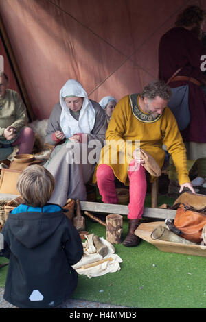 Historical re-enactors in Norman clothes during the 950th anniversary of the Battle of Hastings, Sussex, UK Stock Photo