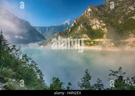 Morning fog at Piva Lake (Pivsko jezero), artificial lake on Piva river in Piva Canyon, Montenegro Stock Photo