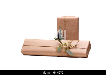 Parcels gift box with kraft paper, isolated image Stock Photo