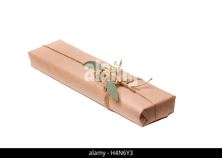 Parcels gift box with kraft paper, isolated image Stock Photo