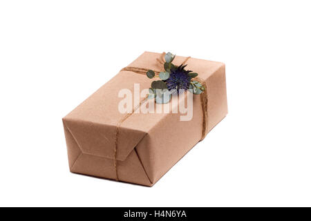 Parcels gift box with kraft paper, isolated image Stock Photo