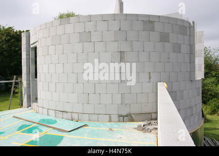 concrete blocks used to build a circular turret room on a new house in Whitstable, Kent, UK Stock Photo