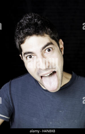 Man drawing tongue joke, young nerdy Stock Photo