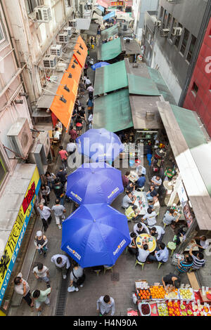 A lot of people walking and dining on the Stanley Street on Hong Kong Island in Central, Hong Kong, China, viewed from above. Stock Photo