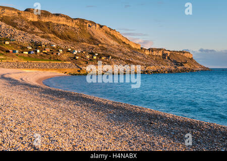 A beautiful spring sunny day on the Beach at Chesil Cove on Portland looking towards West Weares on the Jurassic Coast of Dorset Stock Photo