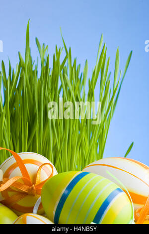 Painted in gold natural easter chicken egg with golden gift ribbon ...