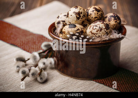 Easter table setting with quail eggs, willow branches Stock Photo