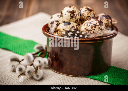 Easter table setting with quail eggs, willow branches Stock Photo