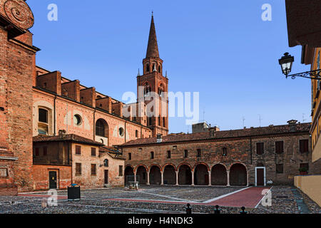 Brick and stone courtyard of ancient roman catholic St Andrea cathedral and monastery in Mantua city of Italy. Stock Photo