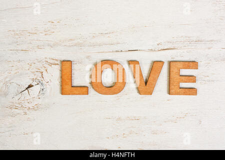 word love in wooden letters on a white background old wooden Stock Photo