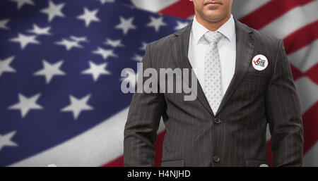 Composite image of serious manager with arms crossed in warehouse Stock Photo