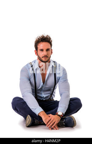 Handsome elegant young man with elegant shirt, suspenders, isolated on white, smiling and looking at camera Stock Photo