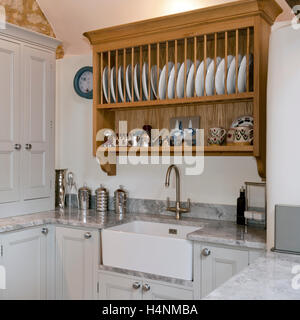 https://l450v.alamy.com/450v/h4nmba/traditional-wooden-plate-rack-shelf-above-contemporary-paint-finished-h4nmba.jpg