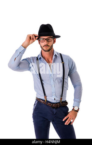 Handsome elegant young man with elegant shirt, suspenders and hat, isolated on white, smiling and looking at camera Stock Photo