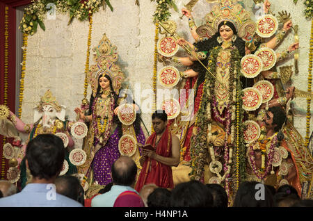 The image of Pandit praying in front of goddess Durga, Mumbai, Maharashtra, India Stock Photo