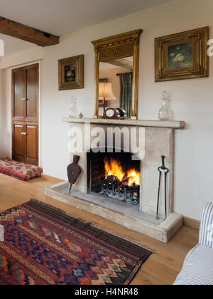 Roaring fire in a period open fire fireplace Stock Photo