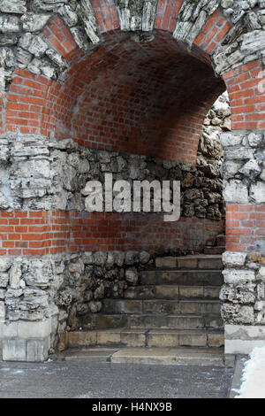 Old stone and brick wall with arch entrance Stock Photo - Alamy