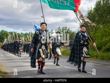 The proud marchers of the Lonach Highlanders;  Scottish men marching, scotland, parade, clothing, march, music, festival, people, bagpipes, british, band, britain, ceremony, costume, highland, kilt, musician, plaid, uniform, culture, dress, fashion, highlander, historic costumes at the Lonarch Highland games in Donside, Scotland, UK Stock Photo