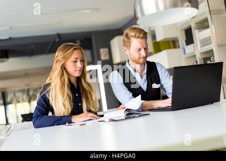 Young couple working in the modern office Stock Photo