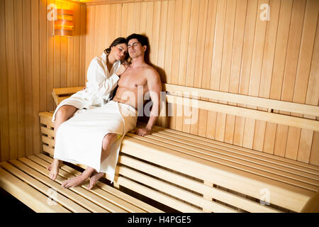 Handsome young couple relaxing in the sauna Stock Photo