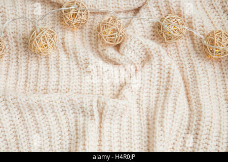Winter knitted woolen blanket with lights decoration Stock Photo
