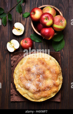Apple pie and fresh fruits on wooden background, top view Stock Photo