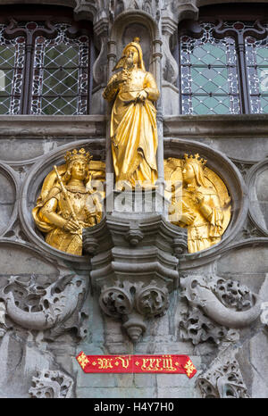 Gilded statues on the façade of The Basilica of the Holy Blood in Burg Square, Bruges Stock Photo