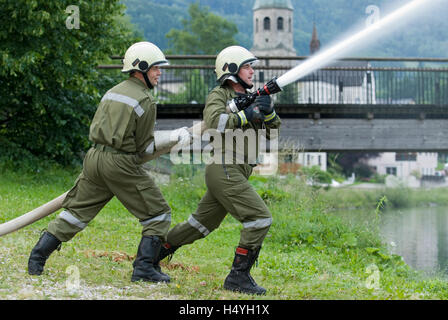 Volunteer Fire Brigade with a water hose, Reichraming, Upper Austria, Austria, Europe Stock Photo