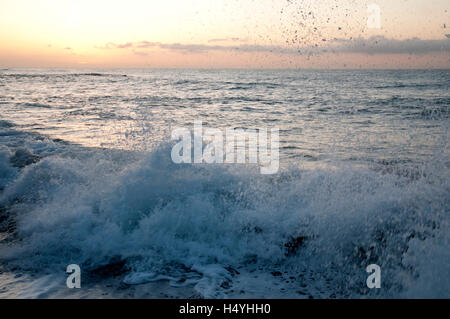 Water and waves on the coast, surf, sunrise, Riviera, Liguria, Italy, Europe Stock Photo