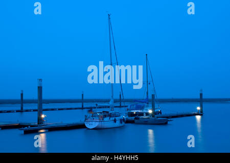 Boats in the harbor, blue hour, Spiekeroog island, North Sea, Lower Saxony Stock Photo