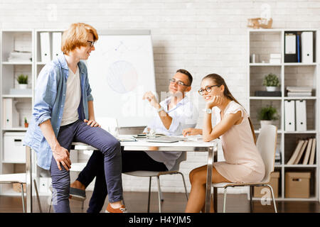 Creative group discussing new working ideas Stock Photo