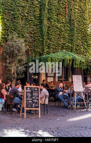 Tourists seated at bar in Trastevere district, Rome, Lazio, Italy Stock Photo