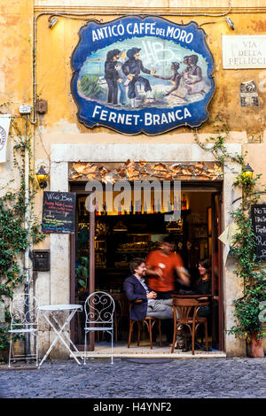 Tourists seated at bar in Trastevere district, Rome, Lazio, Italy Stock Photo
