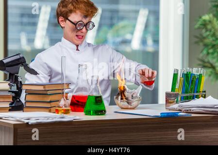 Young crazy chemist working in the lab Stock Photo