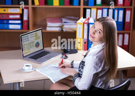 Young Beautiful Business Lady Portrait working at Office Desk Stock Photo