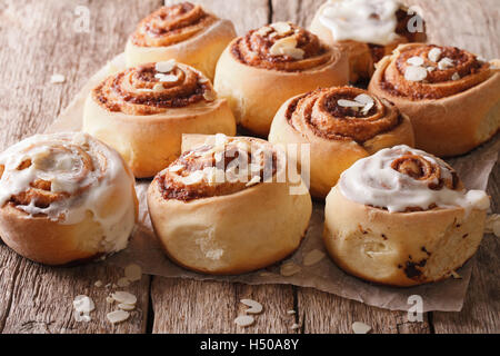 Delicious Cinnabon with almond close up on the table. Horizontal Stock Photo