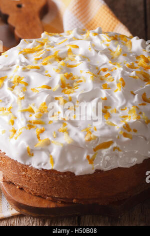 Tres leches cake covered with white icing closeup on a wooden table. vertical Stock Photo