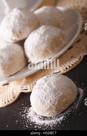 polvoron cookies with pecans and powdered sugar macro on the table. vertical Stock Photo