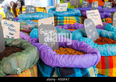 Bags containing guacamole, red paprika and other powders exposed among other spices at an oriental street market Stock Photo