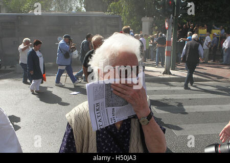 Elderly people clash with riot police during anti-austerity protest against pension cuts in central Athens near the prime minist Stock Photo