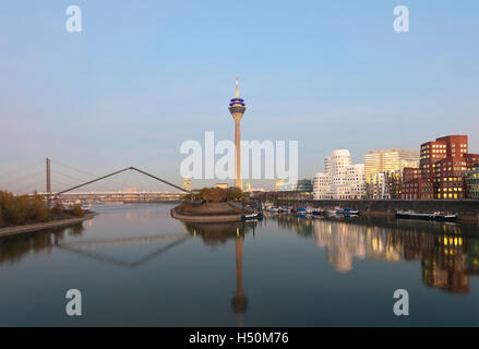 Evening view of modern property development at Media Harbour or Medienhafen in Dusseldorf Germany Stock Photo