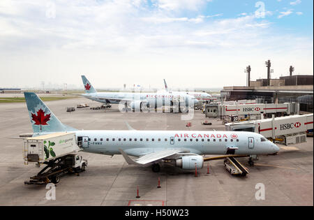 CALGARY, CANADA - JULY 18: Air Canada commercial planes on the tarmac of Calgary International Airport July 18, 2014. Stock Photo