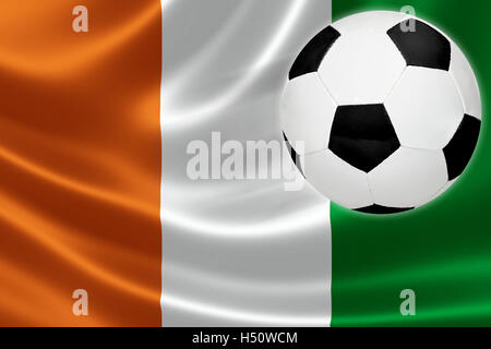 Ball streaks across the flag of Cote d'Ivoire, where soccer is a national passion. Stock Photo