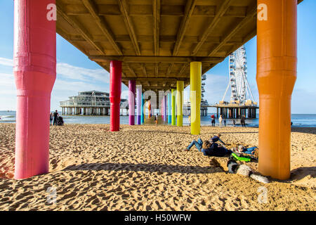 North sea beach at Scheveningen, coastal district of The Hague, Netherlands, renovated seaside pier, ferris wheel, restaurants, Stock Photo