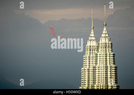 Kuala Lumpur, Malaysia. 18th Oct, 2016. British RAF Red Arrows in formation, flying past KLCC Twin Towers. Credit:  Danny Chan/Alamy Live News. Stock Photo