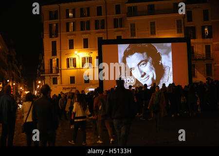 Rome. 18th Oct, 2016. A portrait of late U.S. actor Gregory Peck is present on the screen at Spanish Square on Oct. 18, 2016 in Rome, Italy. The well-known movie Rome Holiday starring Gregory Peck and Audrey Hepburn was screened on Tuesday at Spanish Square of Rome to celebrate the centenary of the birth of Gregory Peck. © Jin Yu/Xinhua/Alamy Live News Stock Photo