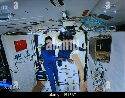 China. 19th Oct, 2016. The two Chinese astronauts Jing Haipeng and Chen Dong aboard the Shenzhou XI spacecraft entered the space lab Tiangong-2 at 6:32 a.m (Beijing Time) on October 19th, 2016. © SIPA Asia/ZUMA Wire/Alamy Live News Stock Photo