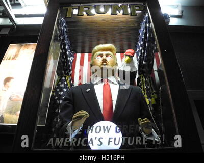 New York, USA. 18th Oct, 2016. A prophecy slot-machine with a likeness of the US Republican presidential candidate Donald Trump stands at the side of the premiere of the documentary film 'Michael Moore in Trumpland' in New York, USA, 18 October 2016. The surprising premiere of the film on the Republican presidential candidate Donald Trump caused a large rush. Photo: Johannes Schmitt-Tegge/dpa/Alamy Live News Stock Photo