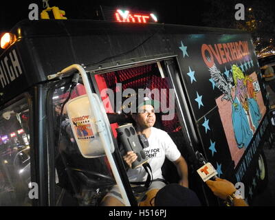 New York, USA. 18th Oct, 2016. Power Malu of the New Yorker Boxclub 'Overthrow' sits in the car of the political campaign of his association, which wants to encourgae citizens to vote, during the premiere of the documentary 'Michael Moore in Trumpland'. The surprising premiere of the film on the Republican presidential candidate Donald Trump caused a large rush. Photo: Johannes Schmitt-Tegge/dpa/Alamy Live News Stock Photo